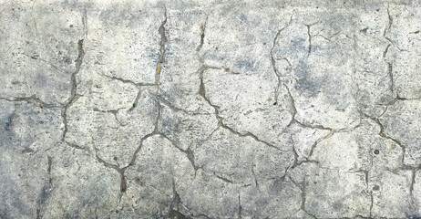 A gray textured background with the effect of aged, cracked stone. Space for creative text and advertising. Copy space 
