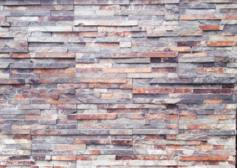 The outer wall is finished with decorative stone. The background has a purple tint.