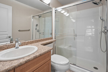 Bathroom with a sink, toilet, and shower