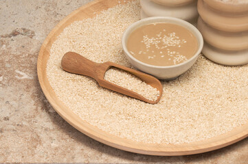 Tahini Latte. Coffee with sesame paste tahini in a cup on the Travertine table