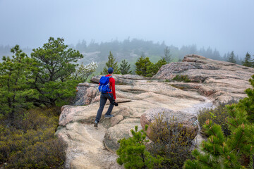 Young man hiking in the mountains
