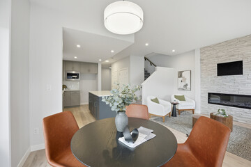 Modern living room with a fireplace and a dining table