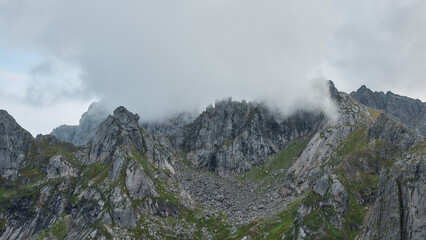 Cloudy peaks of mountain ridge, Norway