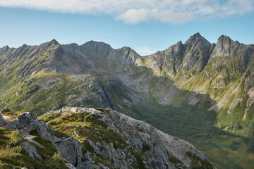 Mountain ridge and green valley under clouds, Norway