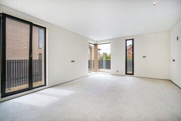 Bright and spacious modern indoor living area with large windows and minimalistic design