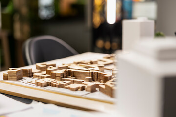 Empty real estate meeting office set up for a residential project, 3D models layout with tools and materials for zoning regulation review and city planning proposals. Infrastructure growth.