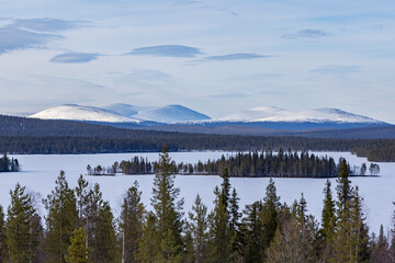 Aerial landscape view into snowy mountains in Finland's Lapland.