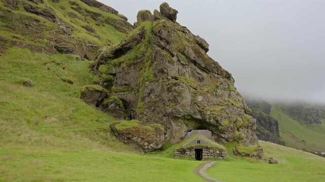 Traditional Turf Cave House in Mountain Rock Iceland
