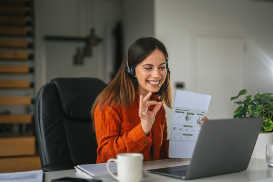 Woman presenting business data during online video call