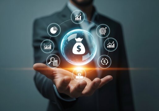 A businessman in a suit holding his hand out, with a floating digital sphere above it. The sphere contains a money bag icon and is encircled by various financial and business icons like graphs, target