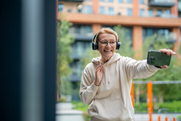 Happy senior woman using smartphone for a video call