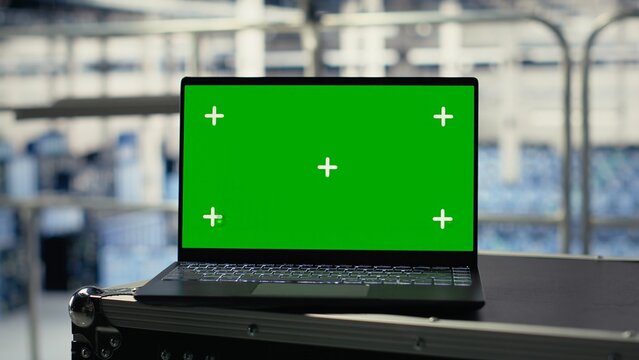 Mockup laptop in server room with machine learning technology detecting data patterns. Isolated screen notebook in data center ensuring rapid data access and transfer rates for AI processing