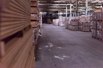 Wood industry warehouse with packaged laminate boards