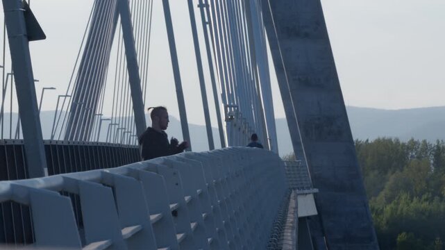 Endurance running workout on a scenic bridge at sunrise for fitness enthusiasts