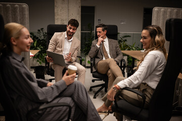 Business colleagues collaborating during a casual office meeting