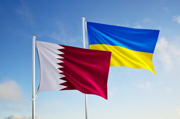 flags of ukraine and qatar over blue sky background.