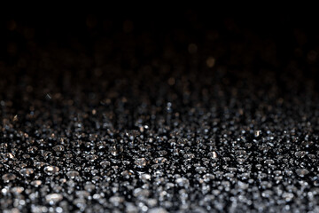 water drops on glass in close-up. abstract dark background with beautiful bokeh. Mockup for your logo. horizontal wallpaper or web banner.