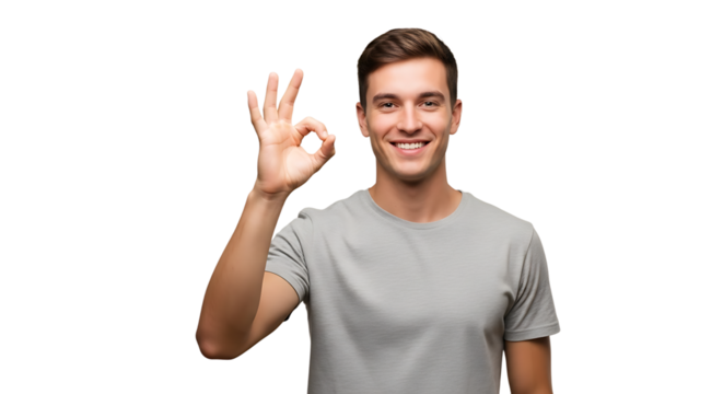 Cheerful man in grey t-shirt gives the 'ok' hand gesture, isolated on black. Confident and giving a positive message.