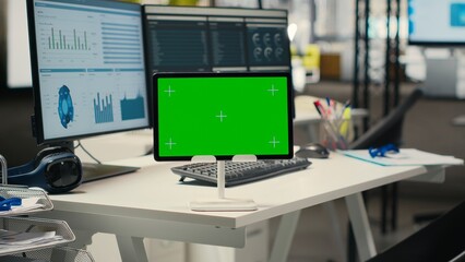 Empty corporate workspace features digital resources and mockup screen, space ready for report...