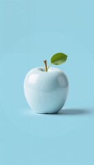 Obraz premium Glossy blue apple with green leaf on pastel blue background 