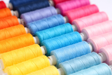 Colorful thread spools as background