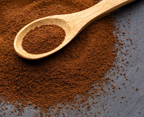Dry instant ground coffee in a spoon - Coffea