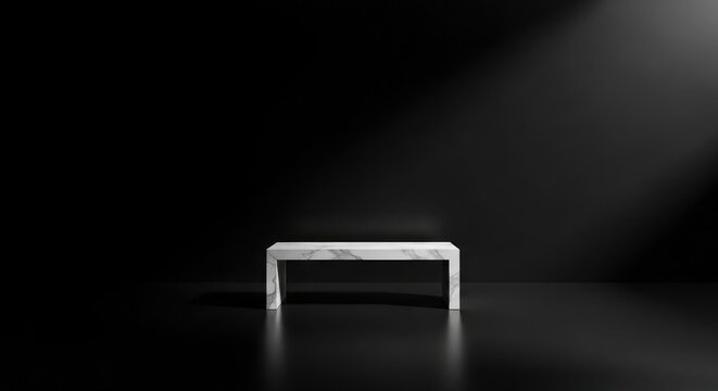 A white marble platform stands centered in a dark room, illuminated by a spotlight from above.