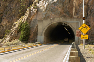 Buffalo Bill  Historic Dam Park & recreation is near. Drive thru mountain tunnels at Cody, Wyoming, USA. See mountain cliff formations in scenic areas of the state