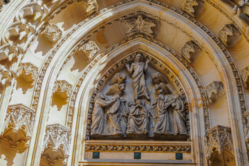 Beautiful aerial and detailed view of St. Vitus Cathedral in Prague Castle, Czech Republic, showcasing Gothic architecture, gargoyles, stained glass, and the historic city skyline.