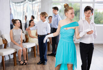 Boy and girl dance couples ballroom dance waltz in studio