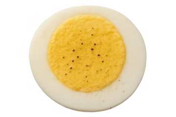 Hard-boiled egg half with yolk and white, sprinkled with pepper, providing healthy protein breakfast food