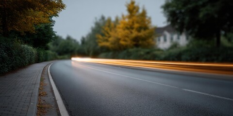 Fototapeta premium Blurry shot of a road with a house in the background