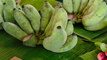 Fototapeta premium Green bananas in the market