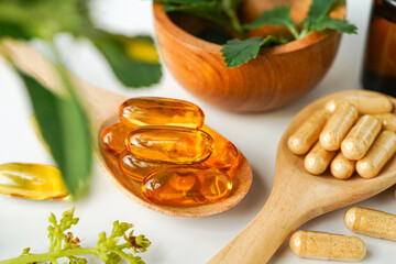 Medicine herbal organic capsule vitamin E omega 3 fish oil drug herbs leaf natural supplements