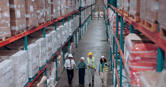 Above, supply chain and people in warehouse, walking and logistics with storage inspection. Inventory, distribution or employees with discussion, export or maintenance with quality control or backlog
