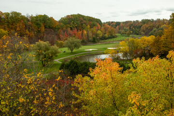 Aerial View of a Golf Course in Fall Foliage, autumn golf course