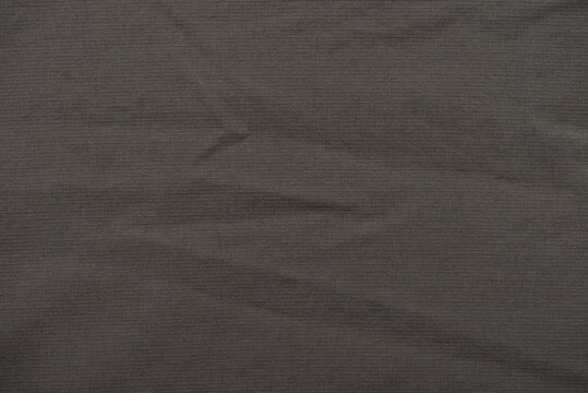 Texture of brown green nylon canvas fabric fashion autumn clothing