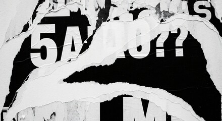 Torn paper with numbers and question marks on black background