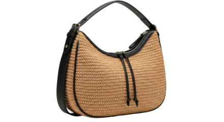 A fashionable woven straw or raffia hobo bag with black leather trim and strap on a white background