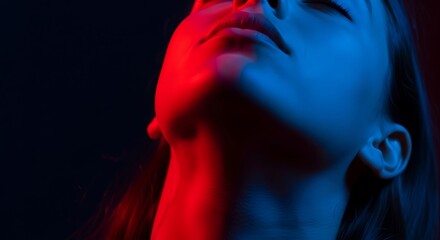 Woman in Red and Blue Light - A Study in Contrast.