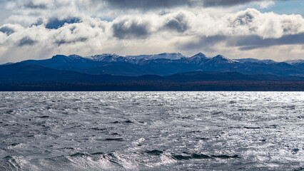 snow covered mountains San Carlos de Bariloche Patagonia Argentina glacial lake Nahuel Huapi, next to the Andes Mountains, base city for skiing in the mountains
