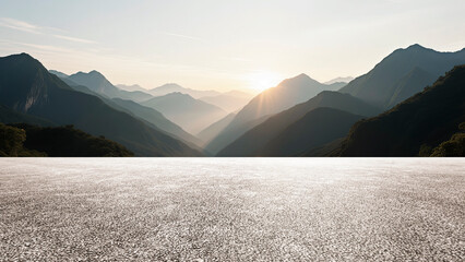 Under a cloudy sky, the wide asphalt road and the distant mountains set against the backdrop