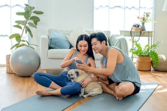 Asian family stay at home together on holiday. Love couple lifestyle. Yoga and exercise concept.