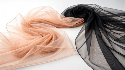 Two rolls of sheer glitter fabric in peach and black