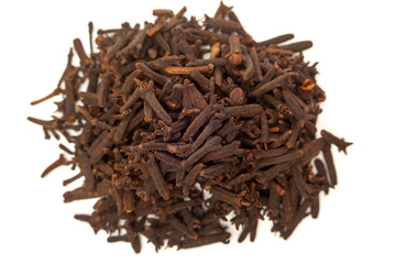 Close-up of cooking cloves grouped on white background