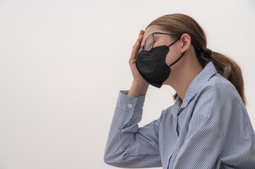 Asian woman having headache becaused of by Bad air pollution (PM2.5). PM2.5 levels meaning the air quality posed a health hazard.