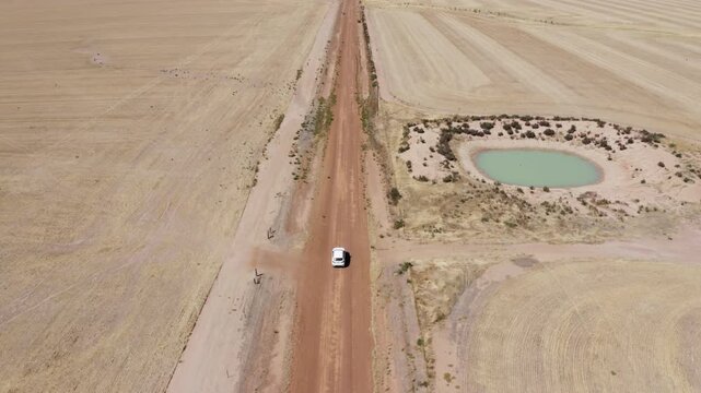 Aerial view of car on a road in the countryside, Western Australia
