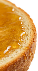 Golden Honey Drizzling on Toasted Bread Slice Isolated on Orange