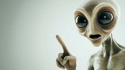 Surprised alien pointing a finger, copy space