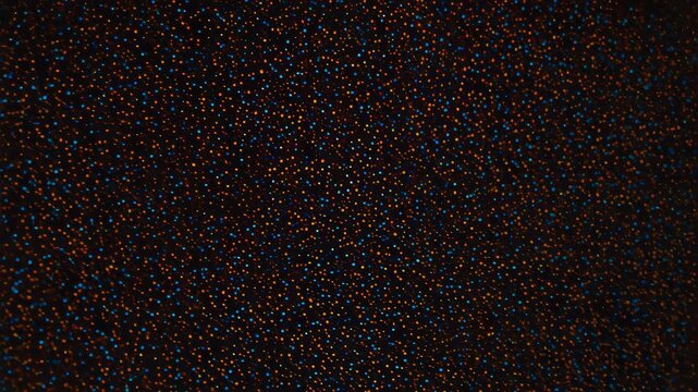 Dynamic Pattern Transformation with Colorful Pixelated Dots Changing from Dense to Sparse Arrangement